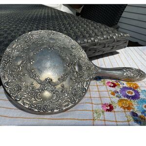 Vintage silver tone hand mirror embossed design on back so pretty